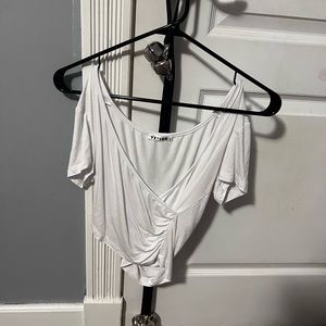 white, cross over tshirt